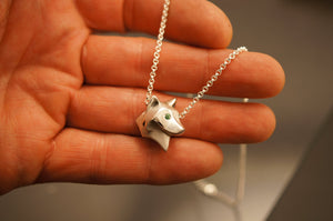 shaggy wolf  silver pendant.   pick your eye color